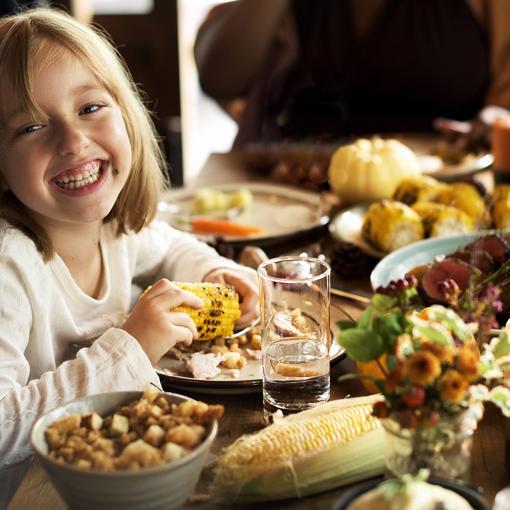 Little girl eating at Thanksgiving